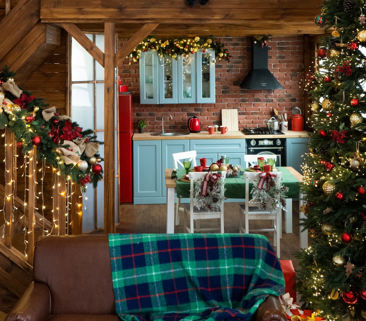 an image of a cabin decorated for Christmas with lots of festive decorations and lights